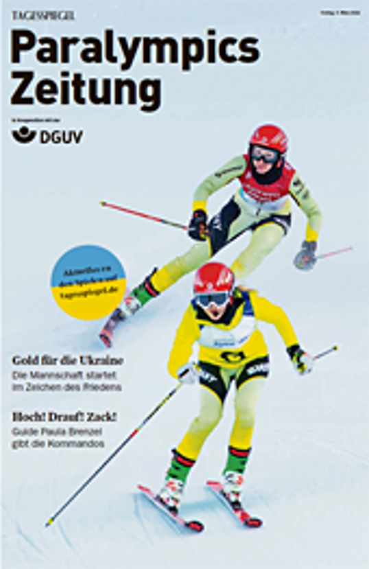 Cover der Paralympics Zeitung zeigt zwei Ski-Abfahrtsläuferinnen