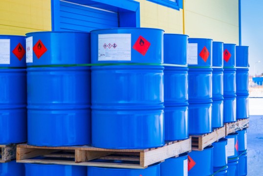 Photo: Blue barrels stacked on pallets