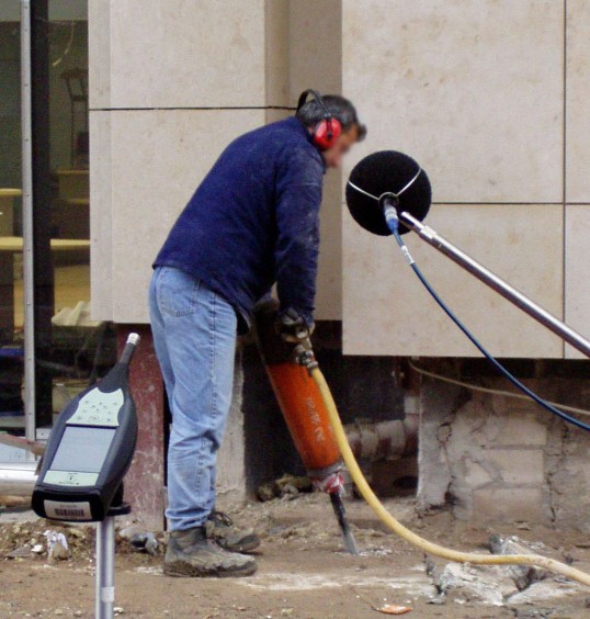 Worker handling a demolition hammer