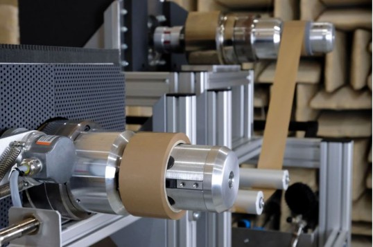 Picture of a machine that unwinds a roll of adhesive tape 
