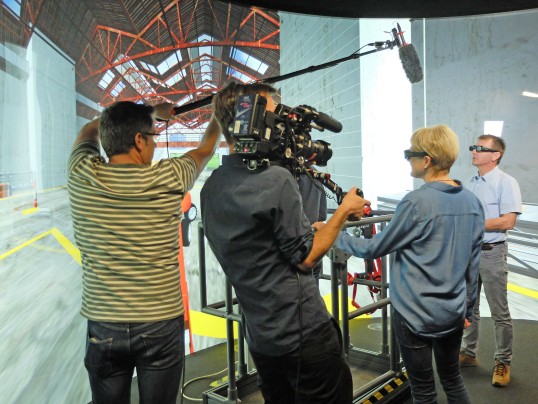 Camera crew filming employees in the VR lab at the IFA