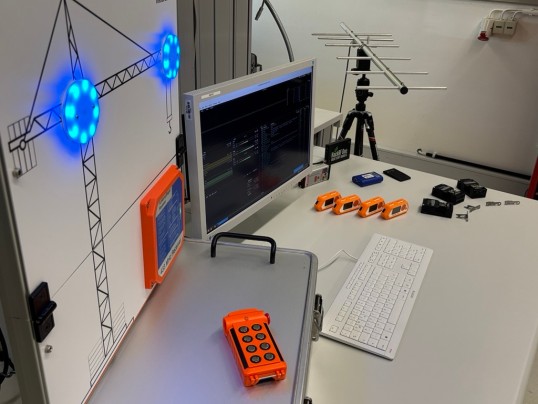 Picture of a desk with a monitor, keyboard and different tools that help prevent cyber attacks