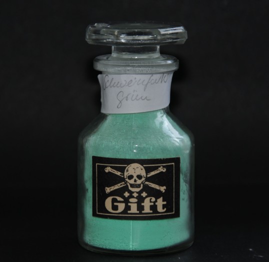 Bottle with a skull on it and a luminous green filling
