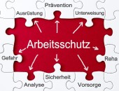 Bild eines Puzzles, in der Mitte steht auf eine roten Teil: Arbeitsschutz.