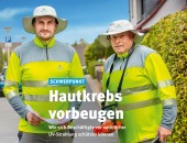 Bild: zwei Männer mit Sonnenschutz, Hut und langärmeliger Kleidung 